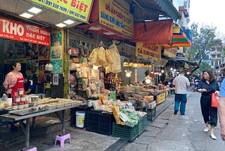 Common scenery in Vietnam. She sells daily food.