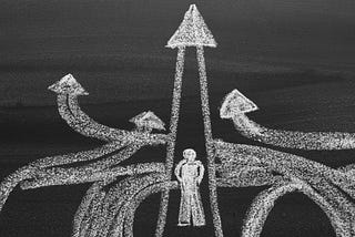 Blackboard drawing: a man choosing different directions