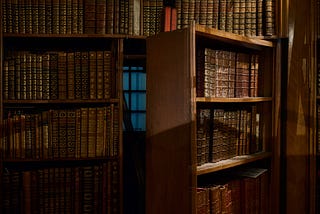 A library bookshelf with a hidden doorway