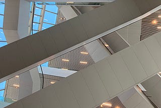Interior of contemporary building showing overlapping lines of stair structure