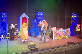 Harry Hill on stage at Newcastle’s Tyne Theatre, with an audience member dressed as a hamster, as other cast members dressed as Stouffer the Cat, a badger, and an ice cream, with a small convoy of badgers in remote controlled cars traversing the stage in the backgorund. You sort of had to be there, really …
