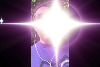 A bright starburst graphic partially obscuring an image of me wearing earbuds. The starburst, which represents sensory overload, is paired with my imitation of a loud motorcycle at the end of the video linked below.