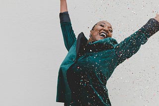 a woman jumping for joy