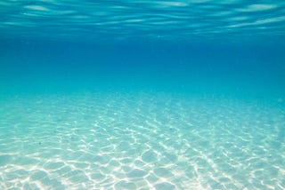 Crystal clear turquoise ocean water, taken from under the water.