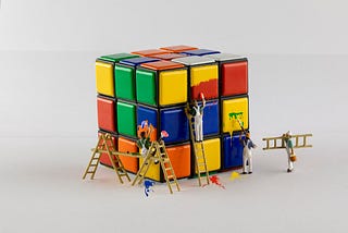 From the Medium blog of Federico Trotta: small people painting a cube