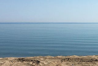 Lake Michigan, sand, water, sky.