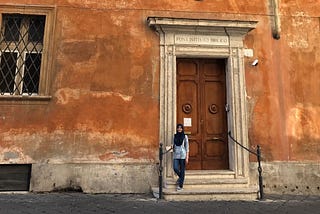 A picture of me standing outside the Pontifical Biblical Institute in Rome, Italy.