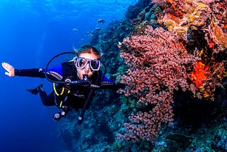 Scuba Diver enjoying the amazing clear, clean water off the Conflict Islands, PNG.
