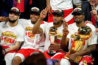 The Toronto Raptors celebrate their 2019 Championship. Pictured: Kawhi Leonard (Finals MVP), Serge Ibaka, Kyle Lowry, Fred VanVleet.