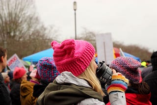 Women wearing pussy hats at a women’s march
