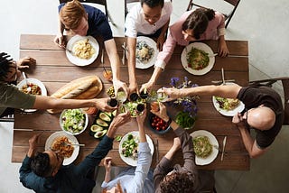 A group of people at dinner making a toast.