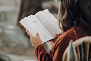 woman reading a book slow