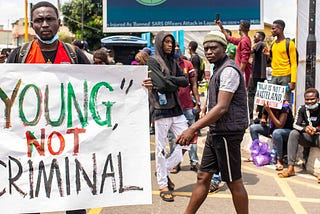 Young Nigerians protesting. I take no credit for the image. It was gotten from Teen Vogue site.