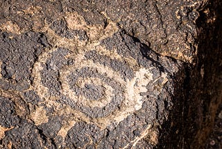 A petroglyph. Adam Daley Wilson’s “inscription paintings” and his “new cave paintings” may do more than just resemble ancient glyphs and cave paintings; they may also ask a similar question: how do we the human remain in the face of inevitable change?