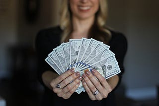 lady holding money