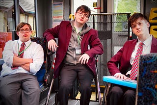 Ruben Reuter, Jack Carroll and Zak Ford-Williams in character as Dan, Mike and Sonny on the Mobility bus