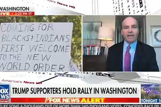 Fox news screen. Chyron says Trump Supporters Hold Rally in Washington. Placard saying coming for blacks and Indians first.