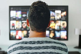 man watching tv