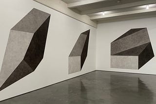 Sol LeWitt — Wall Drawing #411 B,D,E: Isometric figure with progressively darker gradations of gray ink wash on each plane, 2003