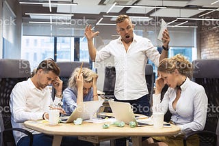 An angry boss scolding his team.