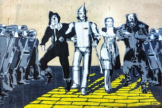 The Wizard of Oz characters marching on the yellow brick path