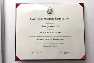 A large diploma that says “Carnegie Mellon University, Amy Jensen Ko, Doctor of Philosophy, Human-Computer Interaction”