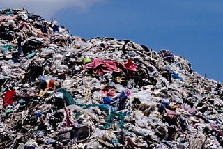 Piles of discarded clothes creating waste