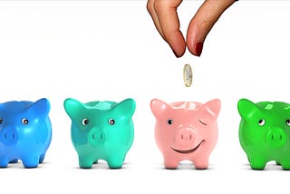 Four pig colored money boxes