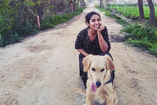 My pet golden retriever Alzu and I somewhere in the rice fields in Sri Ganganagar, Rajasthan on our road trip together