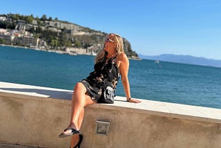 Me sitting on a wall by the Aegean Sea