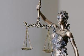 photo of a small scales of justice statue