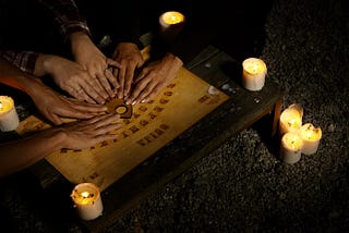 Hands on a Ouija Board, prognosticator of teenaged romances.