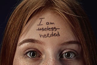 A girl with the a negative thought written on her forehead