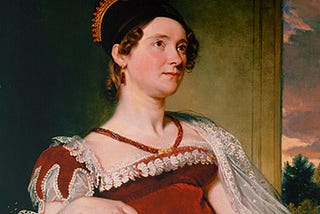 Louisa Adams in a red empire-waist gown with a black cap over her brown curls.