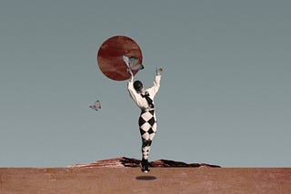 Digtal collage. A man dressed in harlequin costume levitating and holding a big butterfly in his hand.