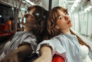 A single woman alone on a train looking totally relaxed and alive. Rich Poley, Progressive Muscle Relaxation for Stress, Anxiety, Insomnia Relief. health, fitness, self-improvement