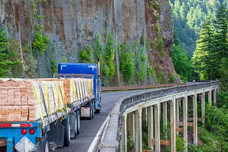 A truck driving on a mountain road