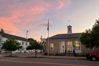 A pinkish sky appears behind the Gambier Post Office.