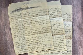 Photo of the story, handwritten in pencil on unfolded, yellow lined paper.