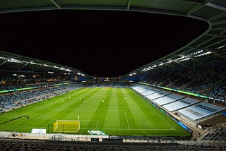 A picture of Allianz Field. A banner reading ‘George Floyd, 8:46’ is visible.