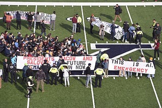 Over 200 Students Disrupt the Harvard-Yale Game to Demand Climate Justice