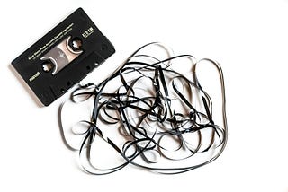 Casette tape with tangled film, to depict a time rewind