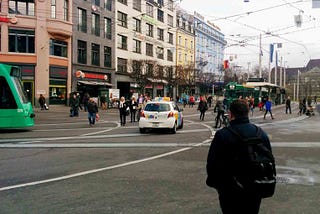 Pedestrians, streetcars, cabs, cyclists and track clutter