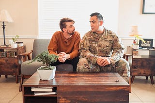 Joey Moehrholt and husband Aaron Moehrholt, sit for a photo while talking about like as a LGBTQ+ Military couple.