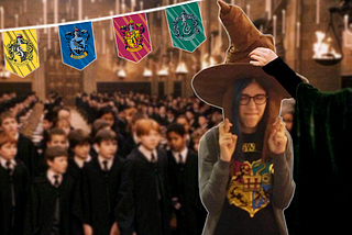 Maayan, the writer of this article, a young woman with glasses and a Hogwarts t-shirt, crossing her fingers at a Hogwarts sorting ceremony, wearing a sorting hat