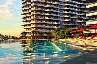 Image of Rosso Bay Residence Building with swimming pool that has the Nikki Beach Residence, ALDAR, and Miramar Logo