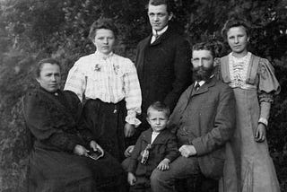 The author’s ancestors in a black and white photograph taken as a seated portrait.