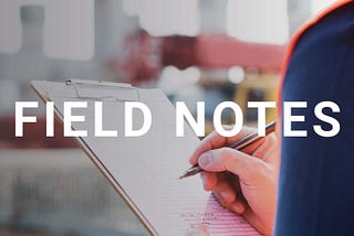 The title “Field Notes” is in the foreground while an image of a construction worker holding a note pad is in the background.