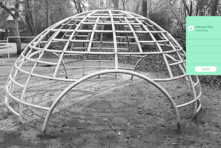 A pop up modal hovers over a metal climbing ‘dome’ for children in an Amsterdam playground. Black and white image.