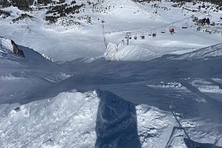 Steep ski run and chairlift.